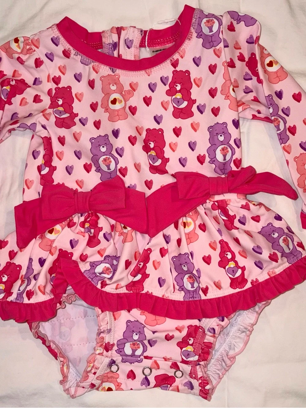 Ruffle Butts X Care Bears long sleeve 1 piece swimsuit/rashguard sz 12-18 mo NWT